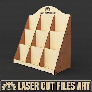 May include: A wooden display stand with nine compartments, ideal for showcasing products. The stand is made of light-colored wood with darker brown edges and supports. The top of the stand features the text "LASER CUT FILES ART".