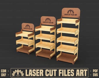 May include: Three wooden display shelves of varying heights. Each shelf has a light brown base and shelves, with darker brown accents and a top panel. The top panels feature the text "LASER CUT FILES ART" and a gear logo.