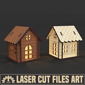 Könnte beinhalten: Zwei Miniaturhäuser aus Holz mit beleuchteten Fenstern und Türen. Eines ist dunkelbraun, das andere hellbeige. Die Häuser haben dekorative Dächer vor dunklem Hintergrund. Der Text "LASER CUT FILES ART" steht unten.