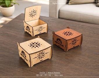 May include: Three square wooden boxes with hinged lids, featuring laser-cut floral patterns on the top and sides. Each box displays the text Laser Cut Files Art on the side. The boxes are shown in light and dark wood tones with 3mm and 4mm thickness.