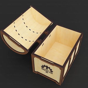 May include: An open wooden box with a hinged lid, featuring a light wood interior and dark brown trim. The box has a rectangular shape with a curved lid and the text "LASER CUT FILES ART" on the front.