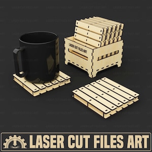 May include: A black mug rests on a wooden pallet-style coaster. Additional coasters and a wooden crate are also visible. The crate and coasters are made of light-colored wood. The text "LASER CUT FILES ART" is displayed.