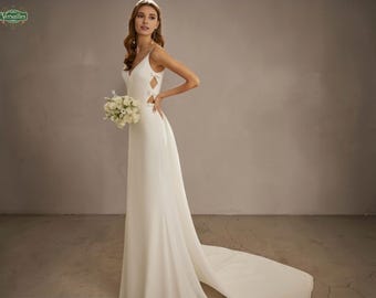 Vestido de novia moderno de crepé blanco: recortes geométricos, espalda descubierta