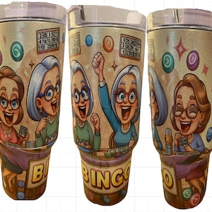 May include: Three stainless steel tumblers with a gold glitter finish and a white handle. Each tumbler features a cartoon illustration of three women playing bingo. The tumblers are decorated with colorful bingo balls and the word "Bingo".