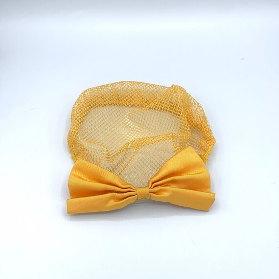 yellow lace snood with clip-on bow 90s does 40s vi