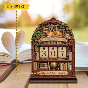 May include: A white ceramic mug with a black handle and the text "But First, Coffee" in a bold, black font. The mug is sitting on a wooden surface. The mug is approximately 4 inches tall.