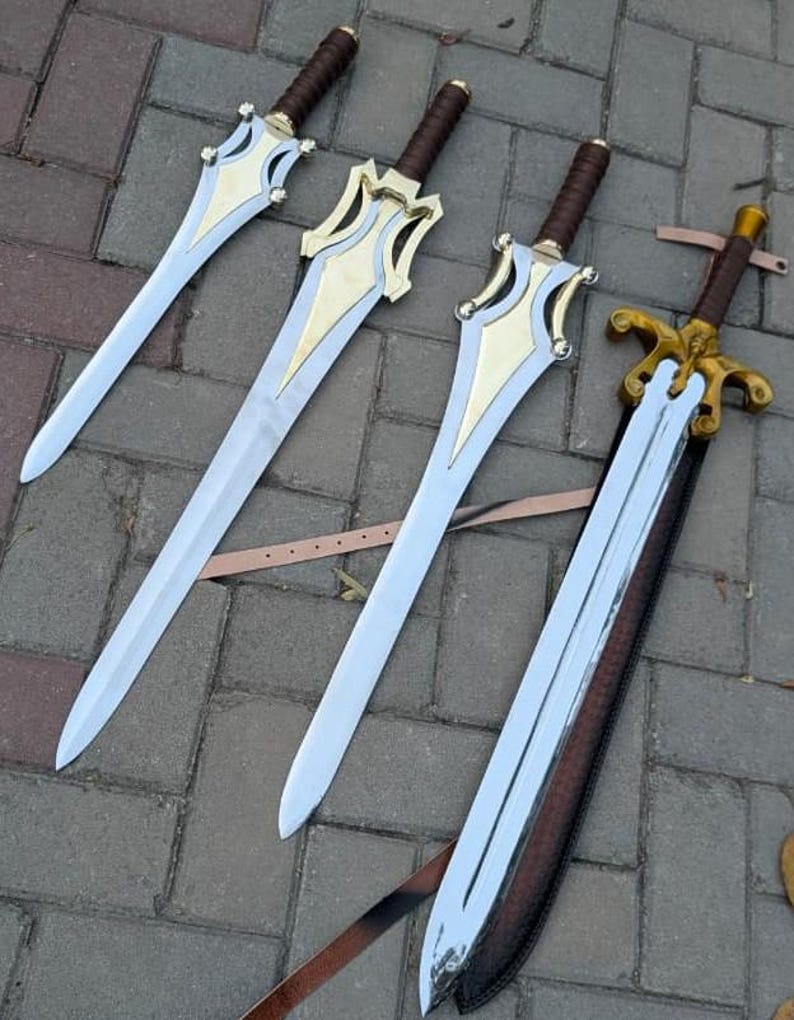 May include: Four swords with silver blades and ornate gold and silver hilts. The handles are wrapped in brown leather. One sword is in a brown leather sheath with a strap.