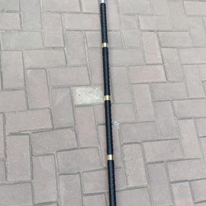 May include: A silver trident with three prongs and a black handle with gold accents. The spear-like weapon is made of metal and is designed for a costume or display.