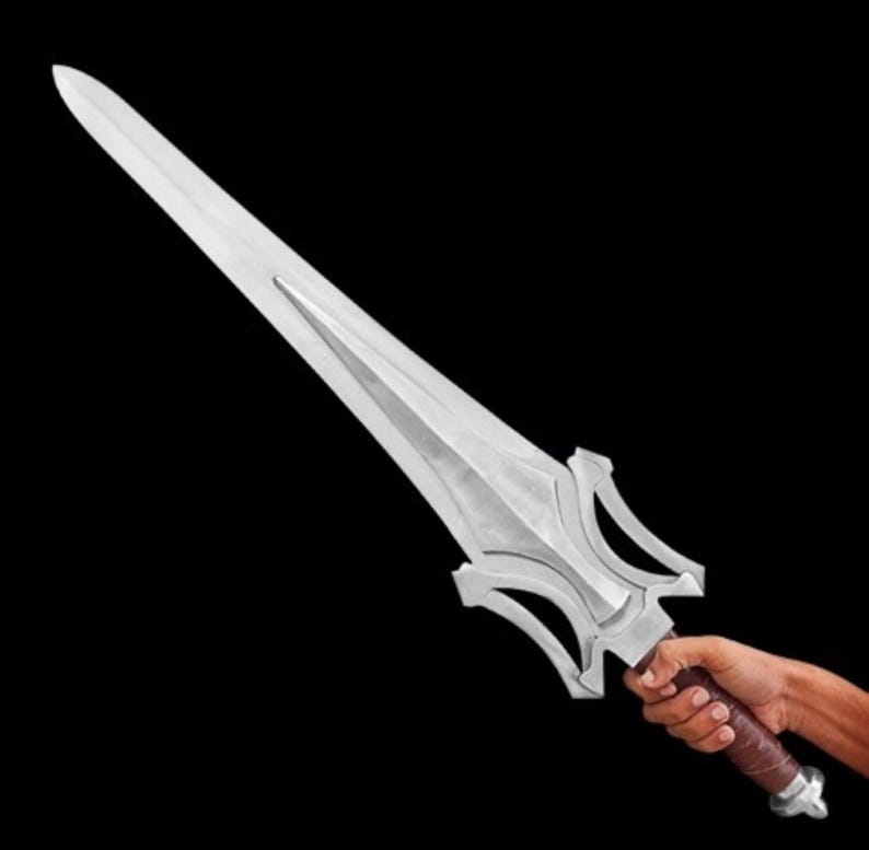May include: A silver-colored sword with a long, pointed blade and a decorative hilt. The hilt has a brown leather-wrapped grip and a silver pommel. The sword is held against a black background.