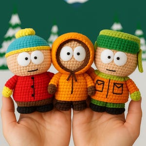 May include: Three handmade crochet dolls representing cartoon characters. The left doll wears a blue hat and red jacket, the centre doll has an orange hooded parka, and the right doll features a green hat and orange jacket with pockets.