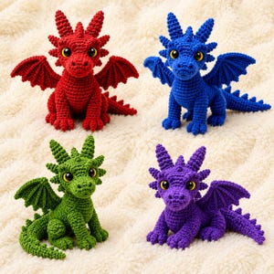 May include: Four crocheted dragon figurines in red, blue, green, and purple. Each dragon features textured yarn bodies, pointed head spikes, small wings, and large yellow eyes with black pupils. The creatures are posed in a seated position.