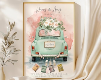 May include: A framed wedding print featuring a vintage teal car decorated with flowers. The car has a "Just Married" sign. The print includes the names "Henry & Anny" and the date "21 July 2025". The bottom of the print reads "TWO HEARTS, ONE JOURNEY ALL OUR LOVE TO YOU BOTH".