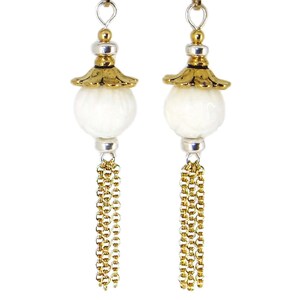 May include: White pearl earrings with gold accents and gold chain tassels.