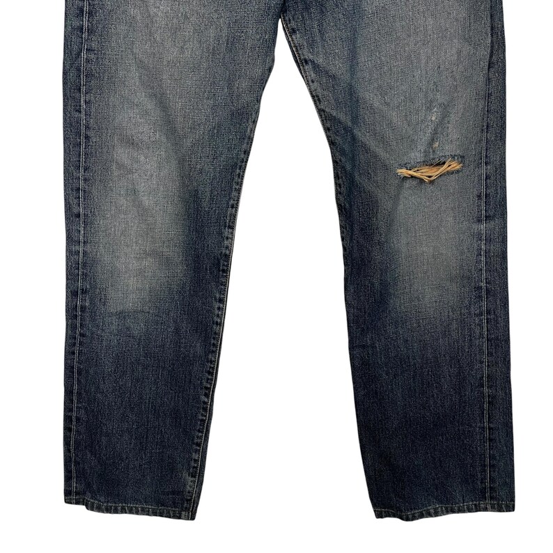 May include: A pair of blue denim jeans with a distressed knee. The jeans have a straight leg and a classic fit.