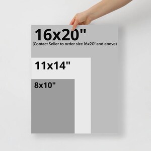 a person holding a piece of paper with a size guide