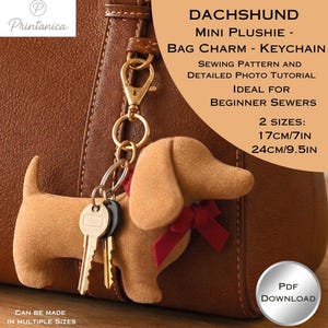 May include: A tan dachshund plushie keychain with a red ribbon, attached to a gold-tone metal clasp. The text reads: DACHSHUND MINI PLUSHIE - BAG CHARM - KEYCHAIN, SEWING PATTERN AND DETAILED PHOTO TUTORIAL, 2 SIZES: 17cm/7in, 24cm/9.5in, PDF DOWNLOAD.