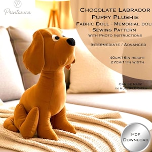 May include: A brown plush Labrador puppy doll, measuring approximately 40cm in height and 27cm in width. The image includes text indicating it's a fabric doll sewing pattern with photo instructions for intermediate to advanced sewers. PDF download available.