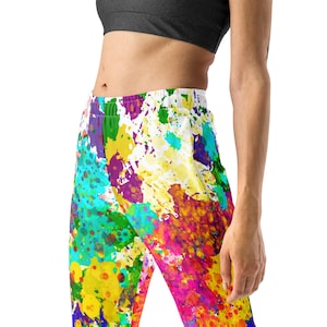 May include: Colorful sweatpants with a paint splatter design. The pants are white with splashes of yellow, orange, red, pink, purple, blue, and green.