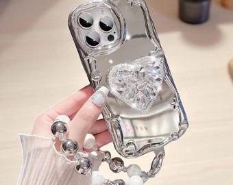 Etui na iPhone'a z kryształowym sercem 3D: srebrny pasek na nadgarstek z błyszczącymi gwiazdkami