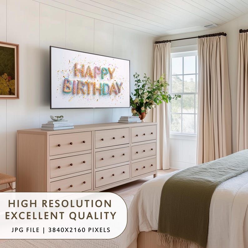 May include: A light wood dresser with nine drawers is below a flat-screen TV displaying "HAPPY BIRTHDAY" in colorful text. The room has neutral tones, with beige curtains and a green bed runner. The image also includes text that says "HIGH RESOLUTION EXCELLENT QUALITY".