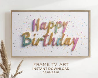 May include: A framed art print with the words "Happy Birthday" in colorful glitter lettering. The artwork is set against a white background with scattered confetti and a wooden frame. The text "FRAME TV ART INSTANT DOWNLOAD" is at the bottom.
