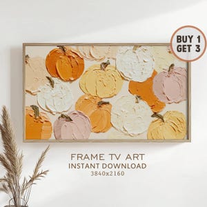May include: A framed artwork featuring a textured painting of pumpkins in shades of orange, yellow, and white. The pumpkins are arranged on a beige background. The text "FRAME TV ART INSTANT DOWNLOAD" is displayed below the artwork.