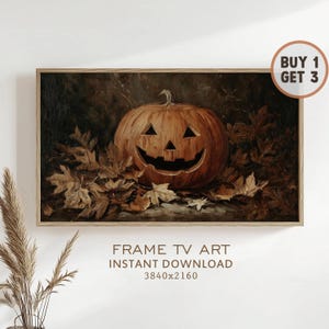Könnte beinhalten: Ein gerahmtes Kunstwerk mit einem geschnitzten orangefarbenen Kürbis mit einem lächelnden Gesicht, umgeben von Herbstblättern. Das Kunstwerk hat einen dunklen Hintergrund und den Text "FRAME TV ART INSTANT DOWNLOAD 3840x2160".