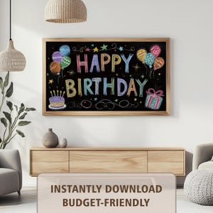 May include: A framed chalkboard sign with the words "HAPPY BIRTHDAY" in colorful chalk lettering. The sign features balloons, stars, a cake, and a wrapped gift. The sign is displayed in a living room setting.