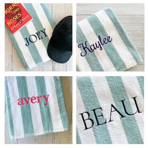 May include: A collection of four soft, plush towels featuring a repeating pattern of vertical sage green and white stripes. Each towel is personalised with embroidered names in various fonts and colours, including JOEY, Kaylee, avery, and BEAU.