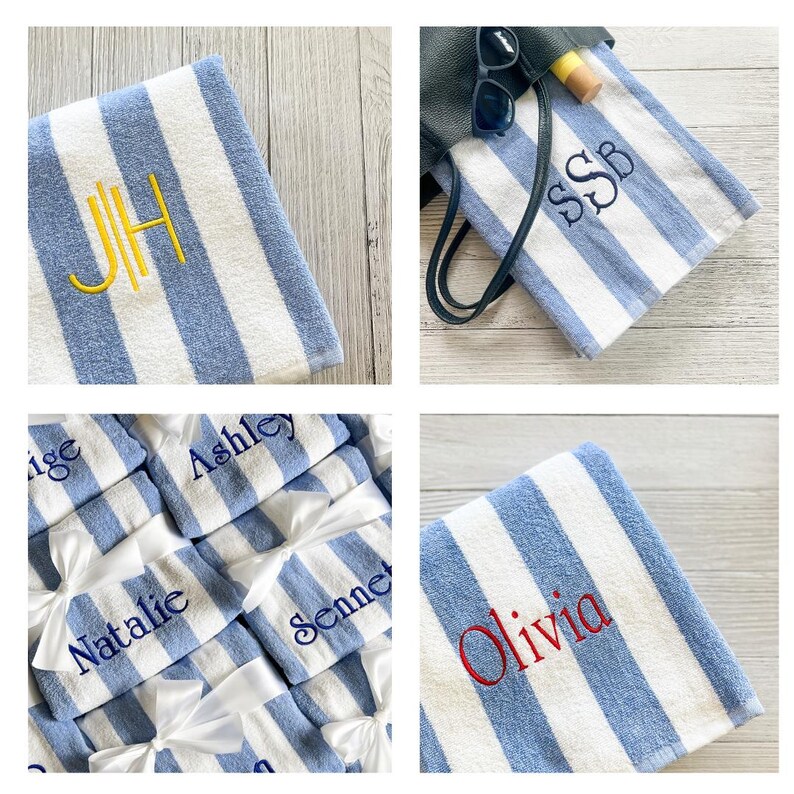 May include: A collection of blue and white striped towels featuring personalised embroidery. The towels display various names and monograms in different thread colours including yellow, navy blue, and red. Some towels are tied with white ribbons.
