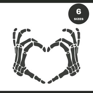 May include: A black and white graphic featuring two skeleton hands forming a heart shape. A black circle in the upper right corner displays the text "6 SIZES" in white. The image is set against a white background.