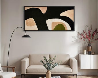 May include: A rectangular wall art piece in a black frame featuring an abstract composition of bold black shapes contrasted against soft beige, cream, and olive green organic forms, creating a balanced visual display on a neutral wall.