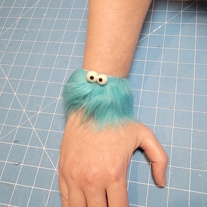 Fuzzy Facelets - Slap Bracelets with Character from All Hands Productions! (TURQUOISE)