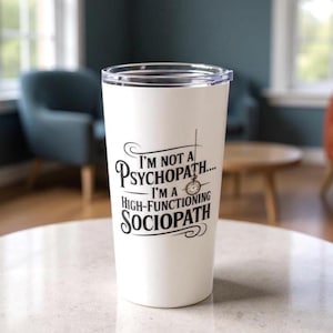 May include: White travel tumbler with a clear lid. The tumbler has black text that reads "I'm not a psychopath... I'm a high-functioning sociopath." The design includes a clock graphic.