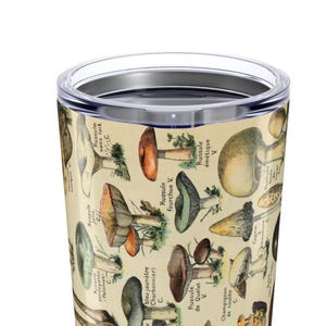 May include: A stainless steel travel mug featuring a vintage botanical illustration of various mushrooms. The design includes detailed drawings of different species with French labels, set against a cream-colored background.