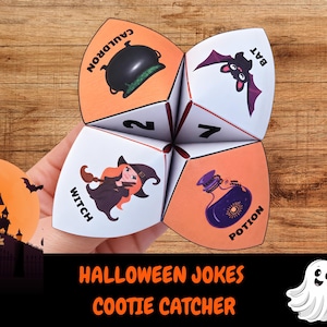 May include: A paper cootie catcher featuring Halloween illustrations including a black cauldron, a purple bat, a witch with a broom, and a purple potion bottle. The paper toy displays the text CAULDRON, BAT, WITCH, POTION, and the numbers 2 and 7.