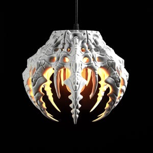 May include: A white pendant light fixture featuring a complex, organic, skeletal structure with downward-pointing, claw-like protrusions. The lamp emits a warm, golden glow from within, illuminating the intricate, textured surface.