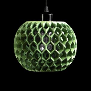 May include: A spherical pendant light fixture featuring a light green, 3D-printed honeycomb lattice structure. The shade surrounds a central light bulb and is suspended from a black cord and a black cylindrical ceiling mount against a black background.