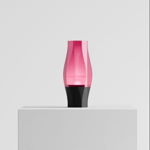 May include: A decorative vase featuring a translucent pink upper section with a curved, tapered silhouette that transitions into a solid black, opaque base. The object has a smooth, polished finish and a symmetrical, modern structural design.