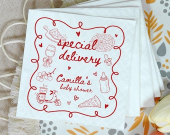 May include: White paper napkins with a red border and illustrations. The napkins feature the text "special delivery" and "Camilla's baby shower" with pizza, baby bottle, and other baby-themed graphics.