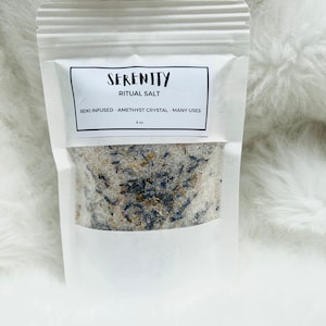 May include: A white pouch with a label that reads "Serenity Ritual Salt Reiki Infused - Amethyst Crystal - Many Uses 6 oz". The pouch contains a white salt with purple and blue crystals.