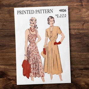 May include: Vintage sewing pattern for a dress with a printed pattern. The pattern is for sizes 12-24. The pattern shows two women wearing the dress, one in a floral print and the other in a solid color.