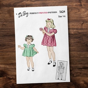 May include: Vintage sewing pattern for a girl's dress, featuring two illustrations of girls wearing dresses with puffed sleeves and collars. The pattern is labeled "Du Barry Perfect Printed Pattern 5624, Size 1-6".
