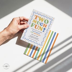 May include: A rectangular birthday invitation card featuring the text TWO MUCH FUN! in colorful letters, with a wavy blue border and polka dots. Below, it reads MATTHEW'S 2ND BIRTHDAY, JUNE 27, 2027, and event details. An envelope with vertical stripes is included.