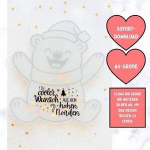 May include: A whimsical illustration of a smiling polar bear wearing a Santa hat and scarf. The bear has the text "Ein cooler Wunsch aus dem hohen Norden" on its belly. Two pink hearts with text and a rectangular box with text are also present.