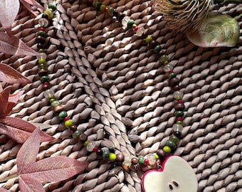 Handmade chunky wood, glass and stone necklace with red ceramic apple charm