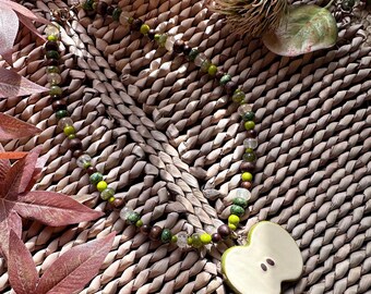 Handmade chunky wood, glass and stone necklace with green ceramic apple charm