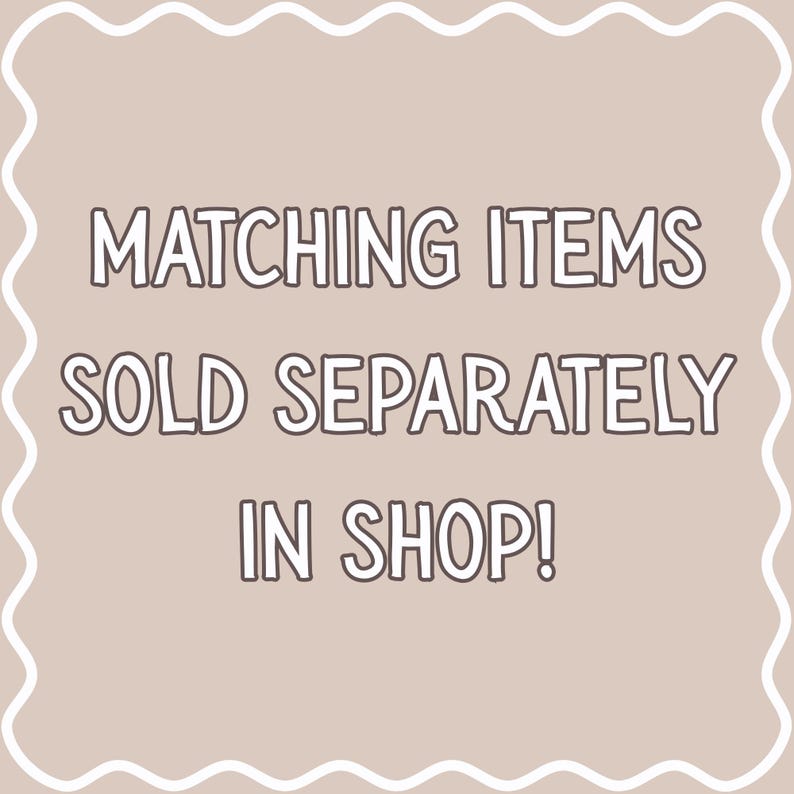 May include: A beige background with a white wavy border and text that reads "MATCHING ITEMS SOLD SEPARATELY IN SHOP!" in a bold, outlined font. The text is centered and clearly visible.
