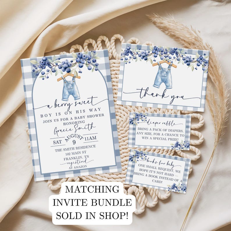 May include: A baby shower invitation suite with a blueberry theme. The invitation features a blue gingham pattern, blueberry sprigs, and a pair of overalls. The text reads "a berry sweet boy is on his way". Includes thank you and raffle cards.