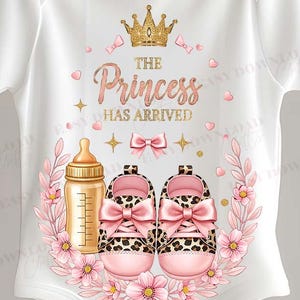 May include: White baby bodysuit featuring a gold crown, the text "The Princess Has Arrived," a baby bottle, and pink leopard print baby shoes with bows. The design is framed by pink flowers and leaves.